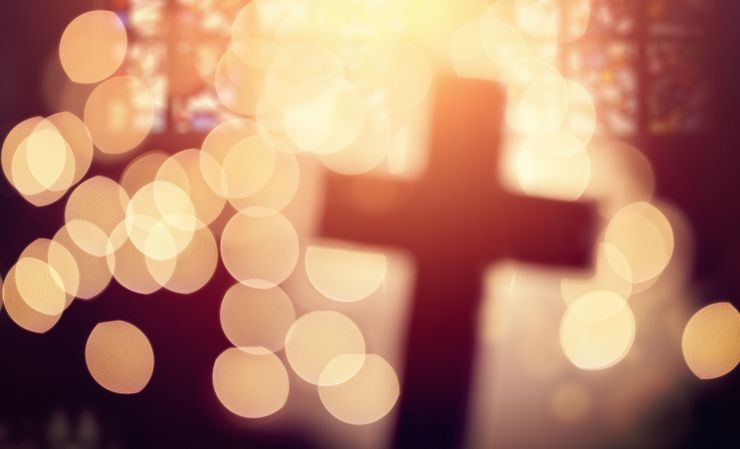Cross of Christ surrounded by defused light
